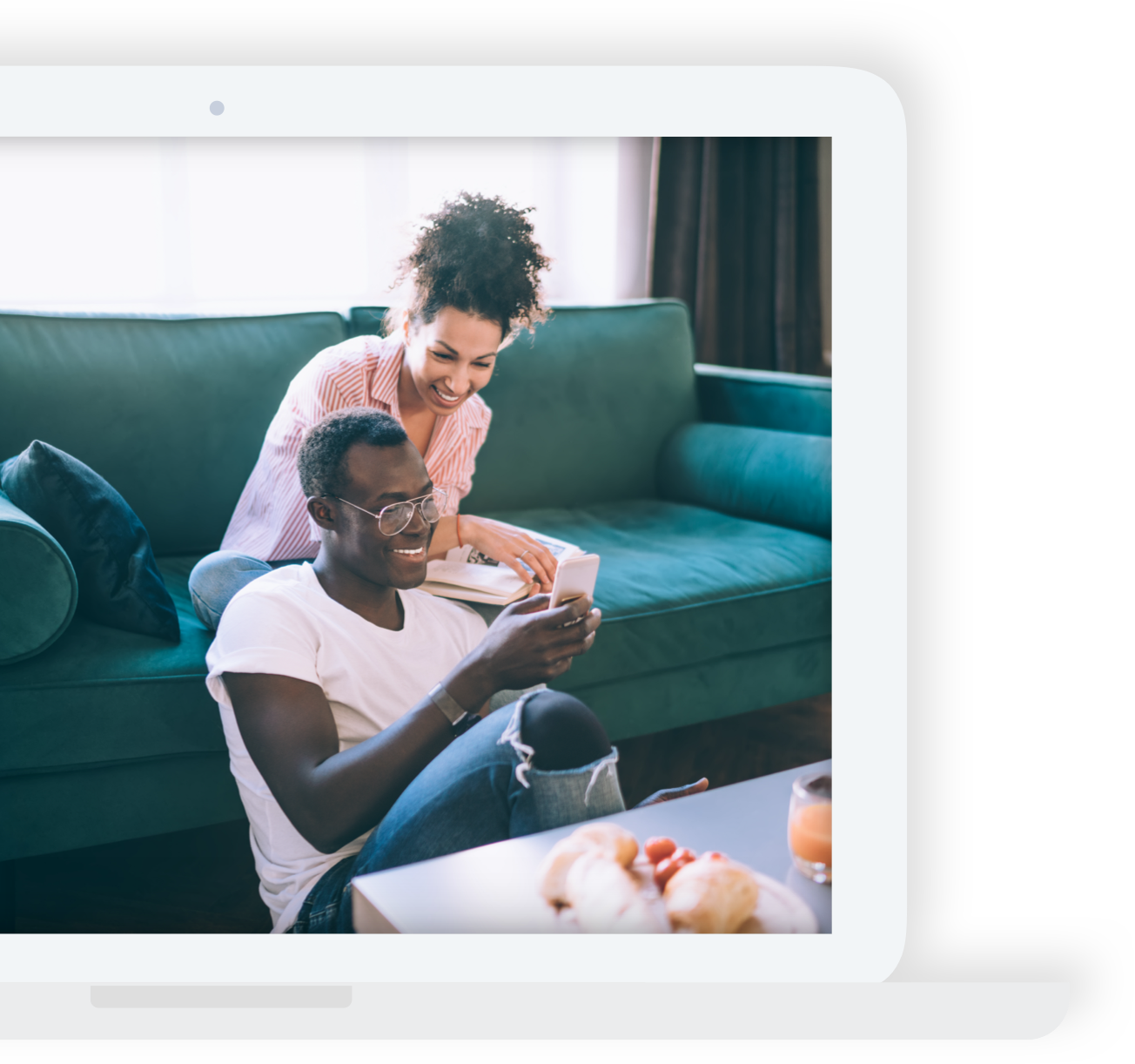 couple on couch looking at a phone